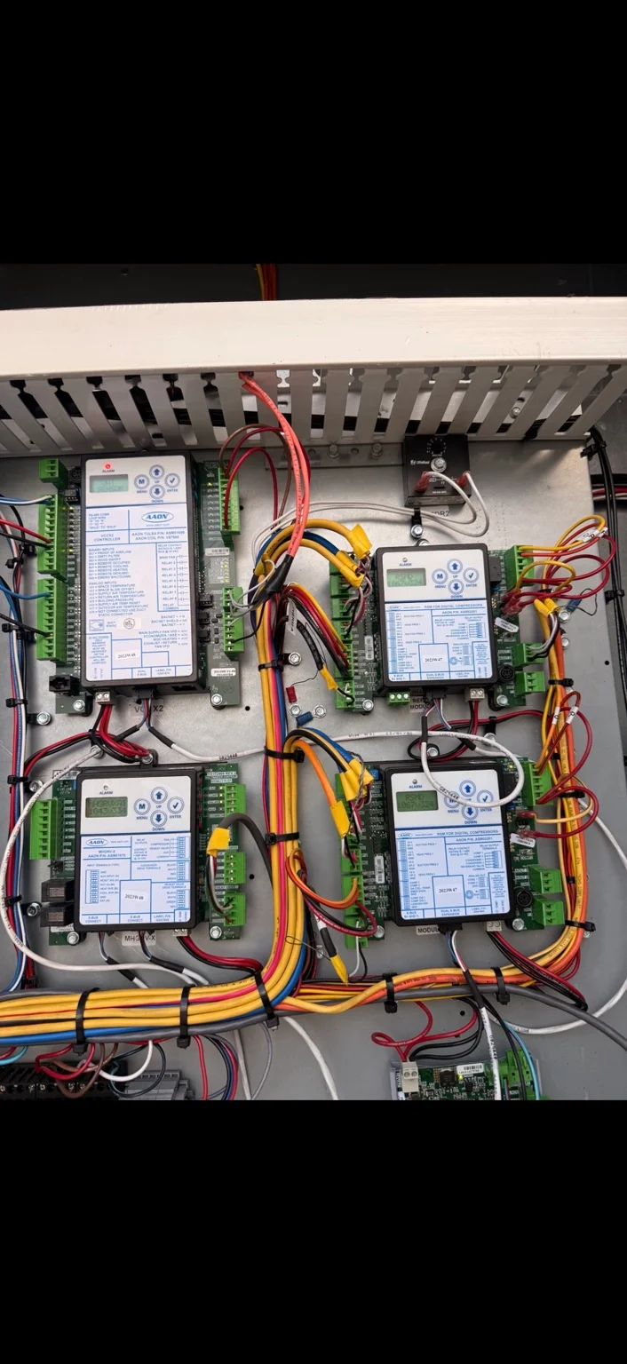 Commercial AC control panel with electronic control modules and wiring