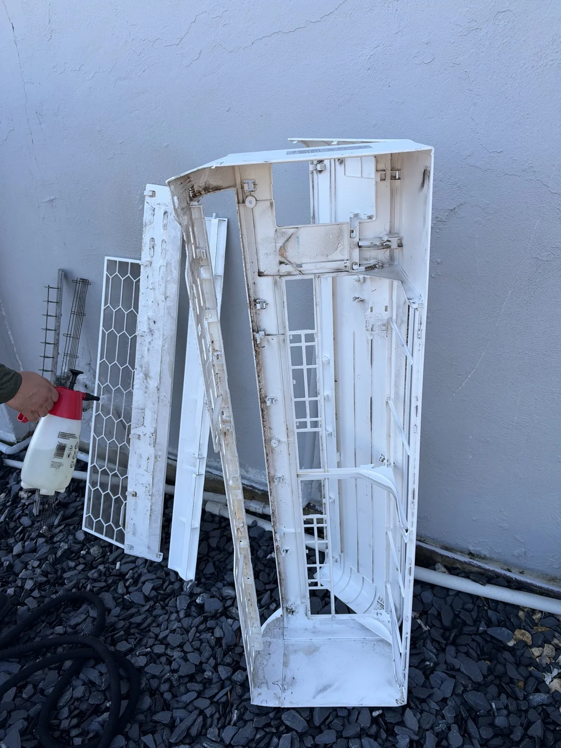Removed mini-split housing, filters and louvers set outside for cleaning