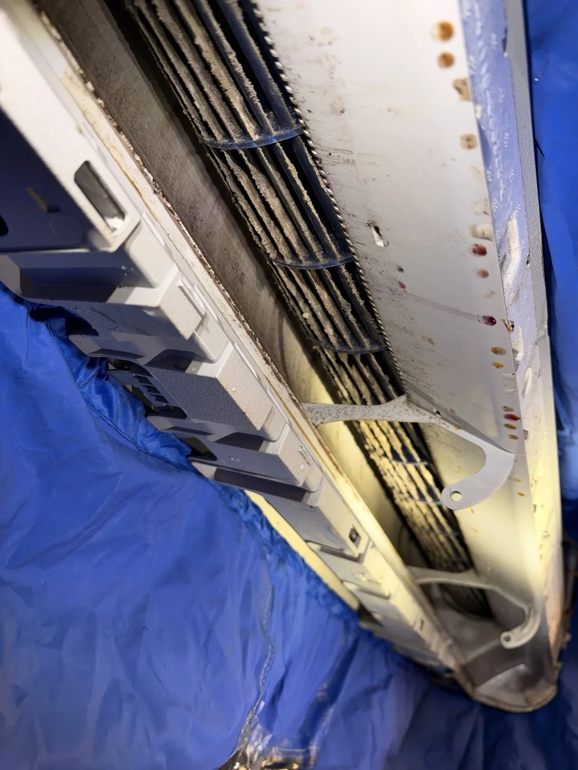 Blower wheel with visible debris inside a protected cleaning area